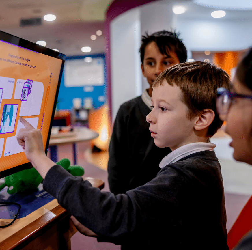 A boy tries his hand at tech-exhibit at Cambridge Science Centre